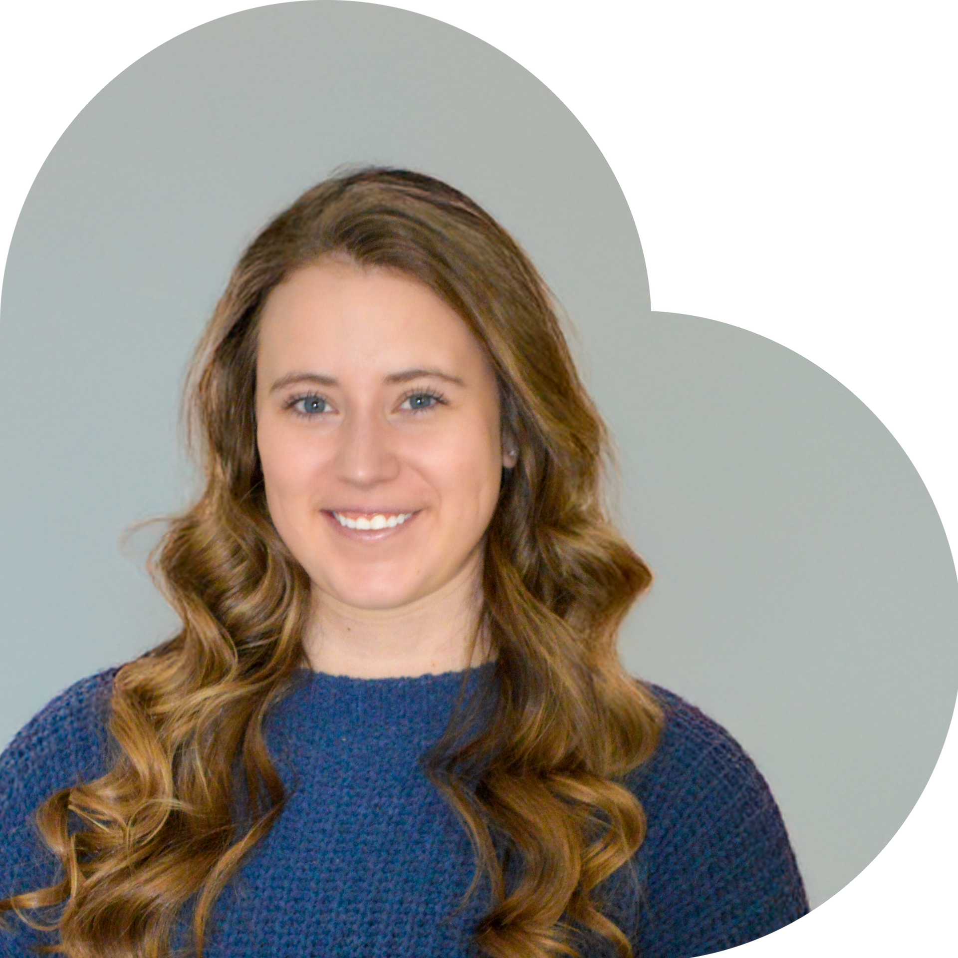 Girl in a navy sweater smiling.