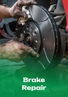 A person is working on a brake disc on a car. | Emerald Automotive