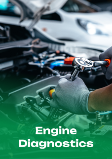 A person is working on a car engine with a wrench. | Emerald Automotive