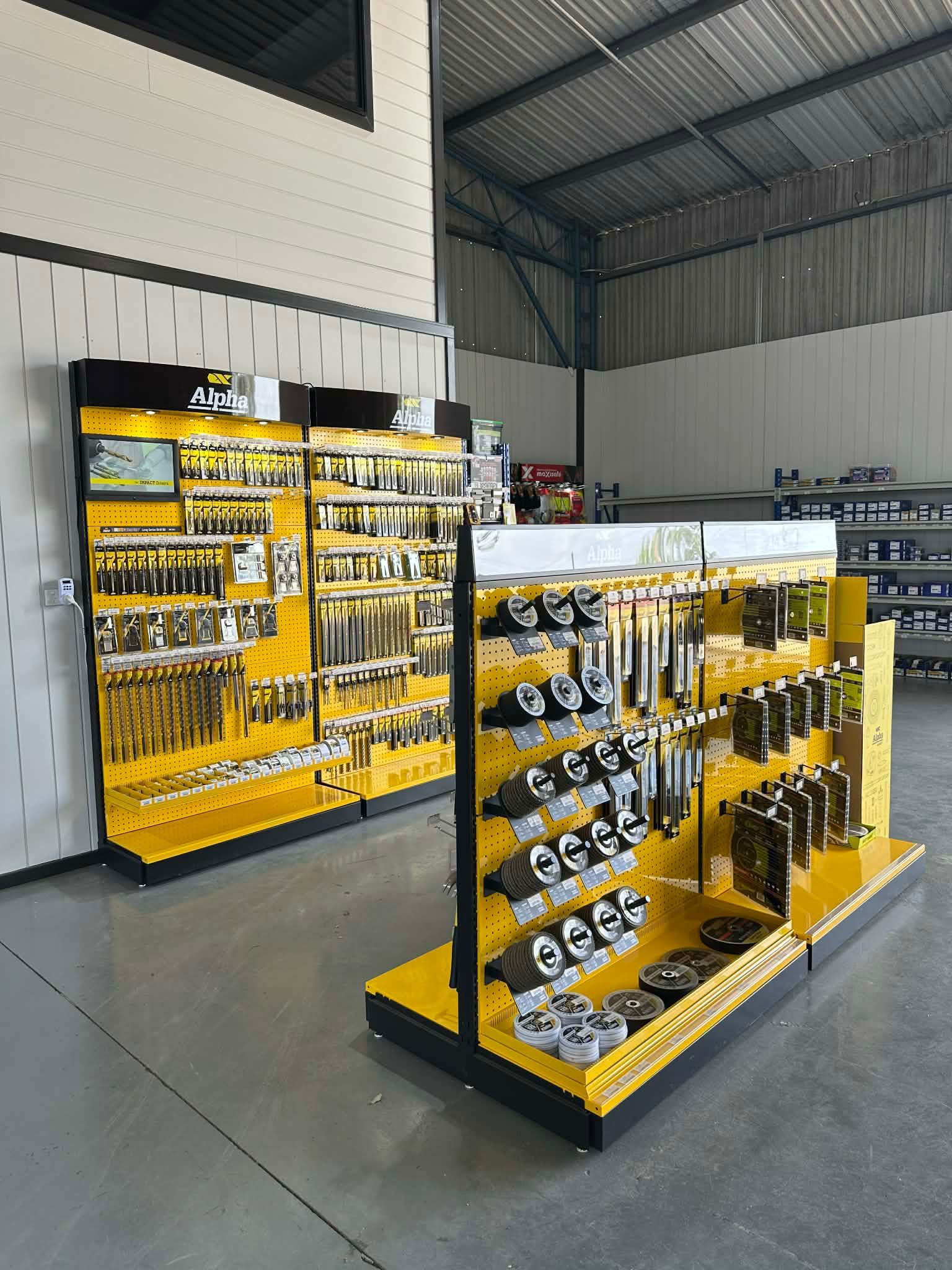 Person Using a Power Drill to Install Wooden Deck Boards — DGW Wholesale Timber & Hardware in Heddon Greta, NSW