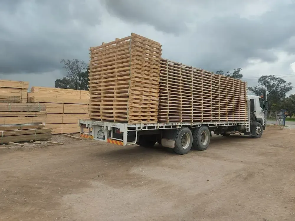 Flatbed Truck Loaded with Stacks of Wooden Pallets — DGW Wholesale Timber & Hardware in Cessnock, NSW