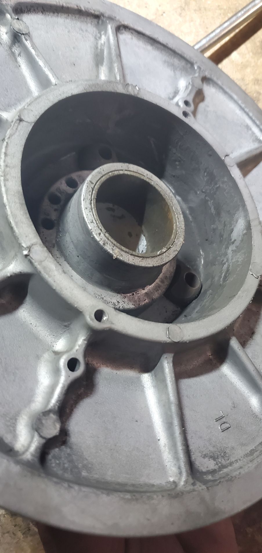 a close up of a metal object with a hole in the middle .