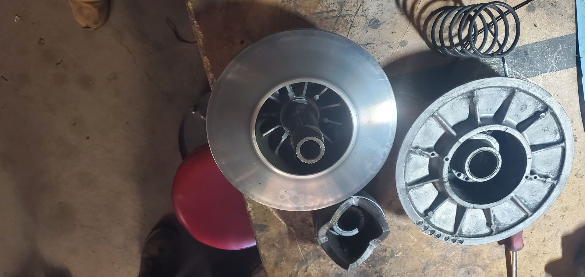 a couple of metal objects sitting on top of a wooden table .