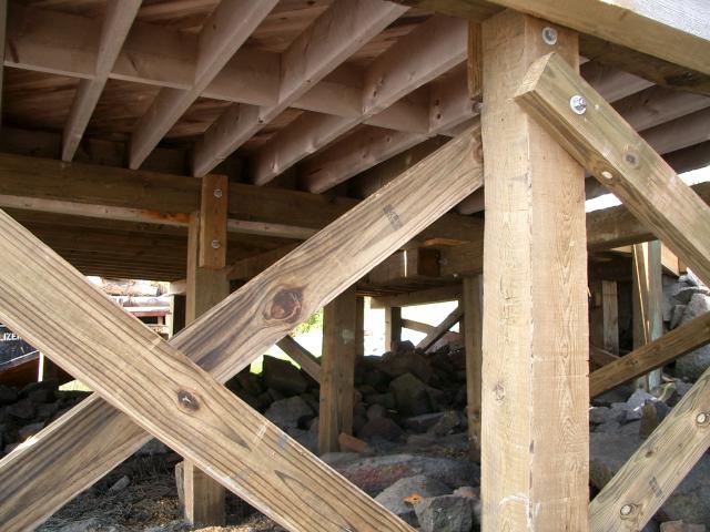 Bare Bones Structure Repair — Wooden Posts Under Dock in Thomaston, ME