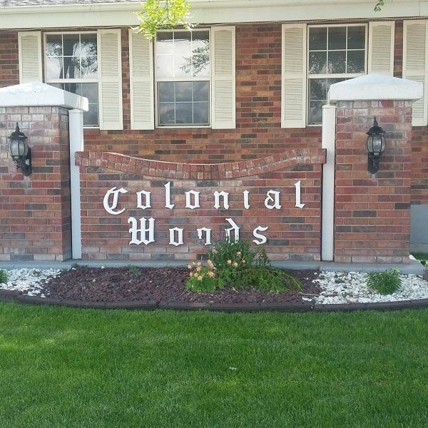 Colonial Woods sign at mobile home park