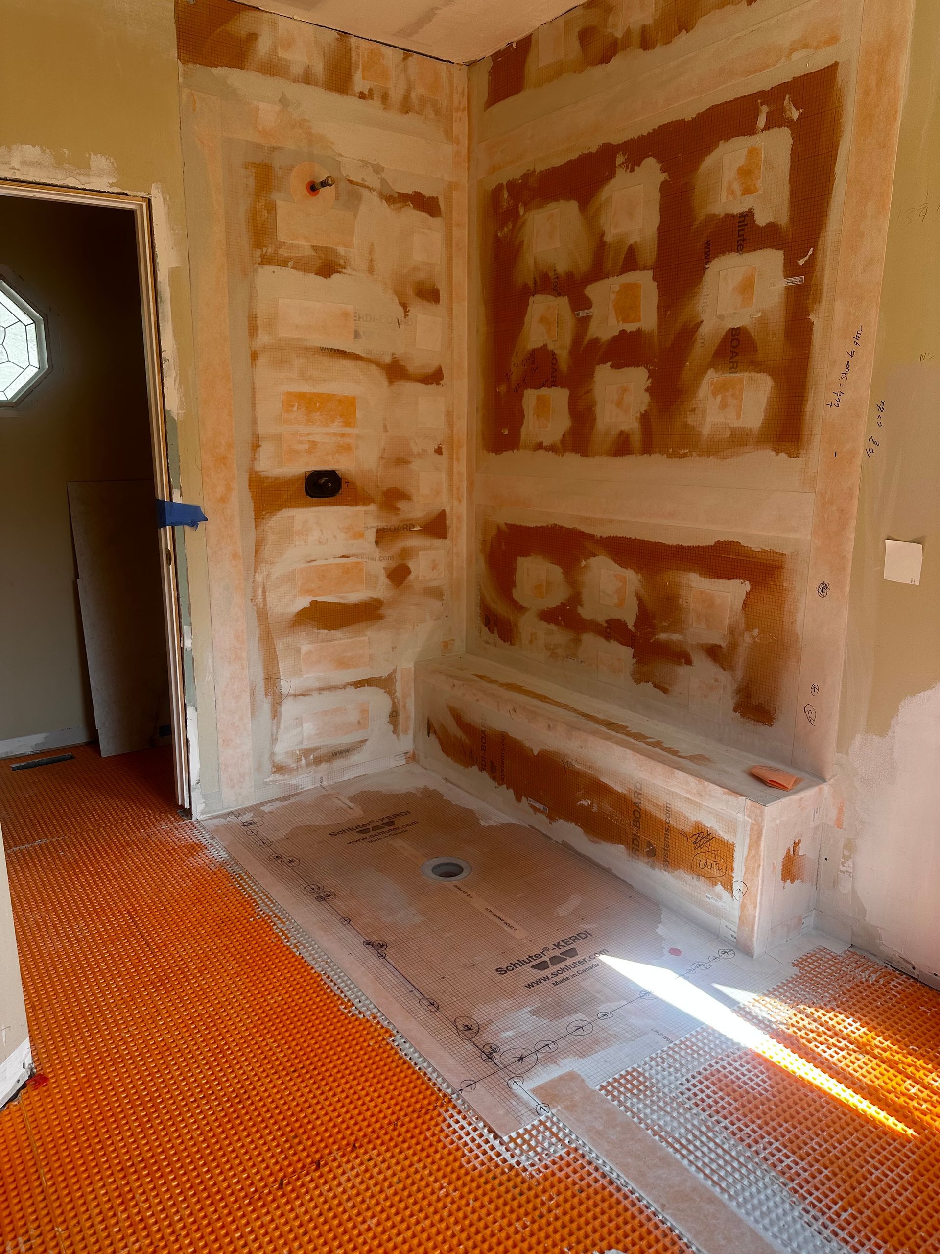 The inside of a moving truck filled with boxes and blankets.