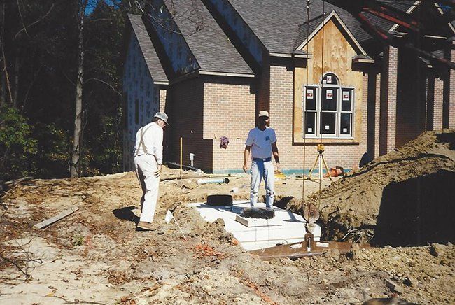 Two Workers Assisting — Plymouth, IN — Creed Septic System Specialist