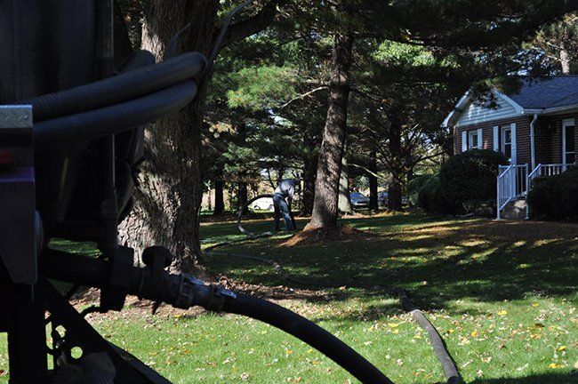 Man Cleaning Residential House Septic Tank — Plymouth, IN — Creed Septic System Specialist