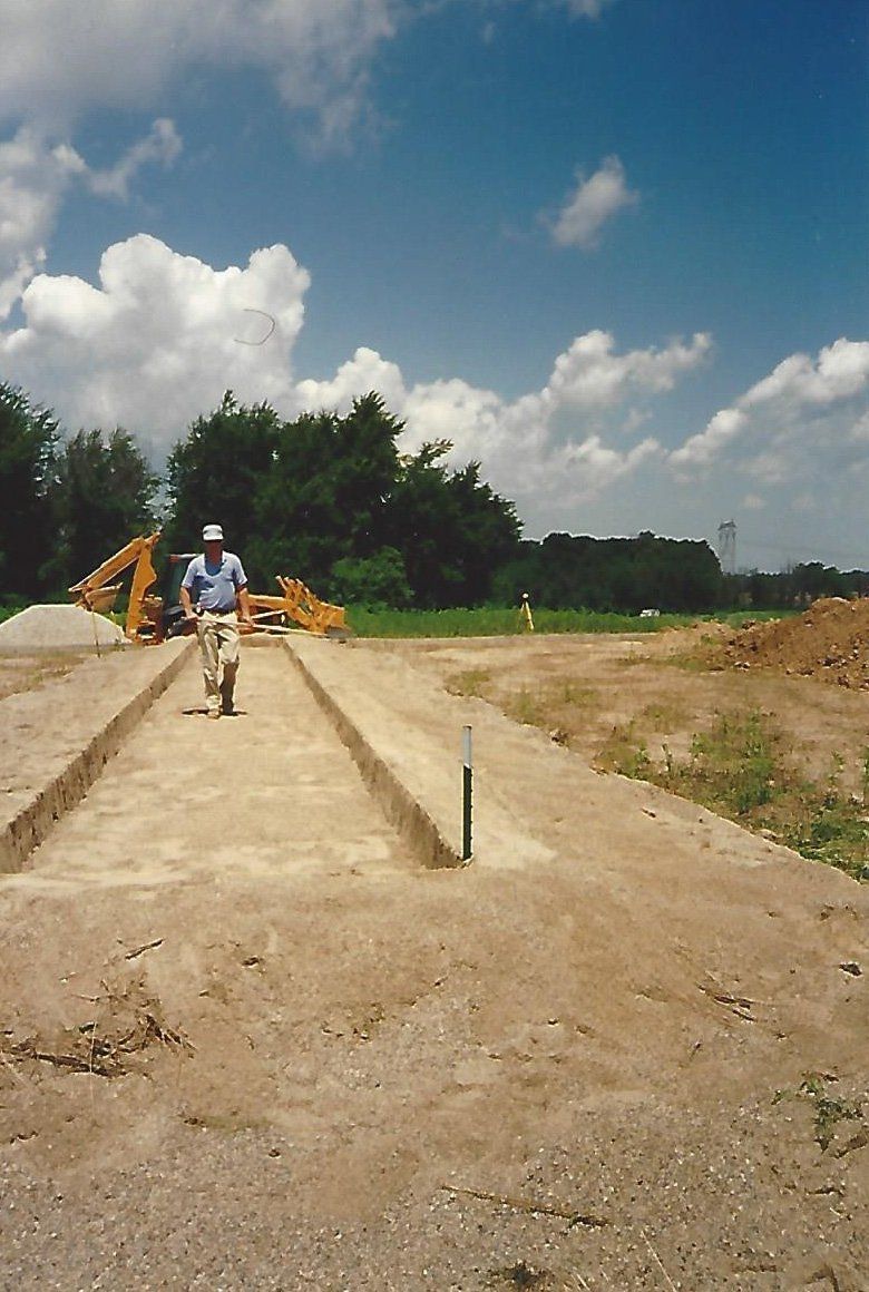 Worker Walking on a Path — Plymouth, IN — Creed Septic System Specialist