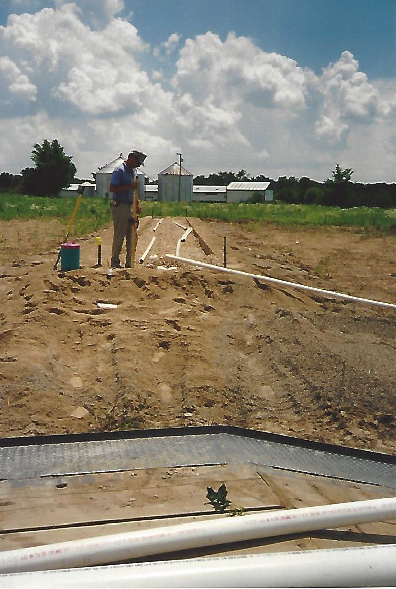 Worker Looking at the Ground — Plymouth, IN — Creed Septic System Specialist