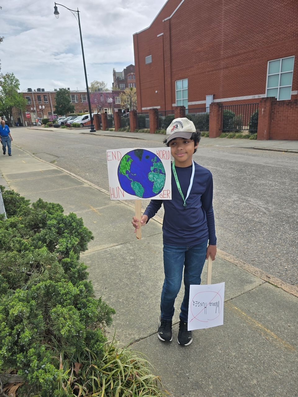 Young boy holds sign for crop walk