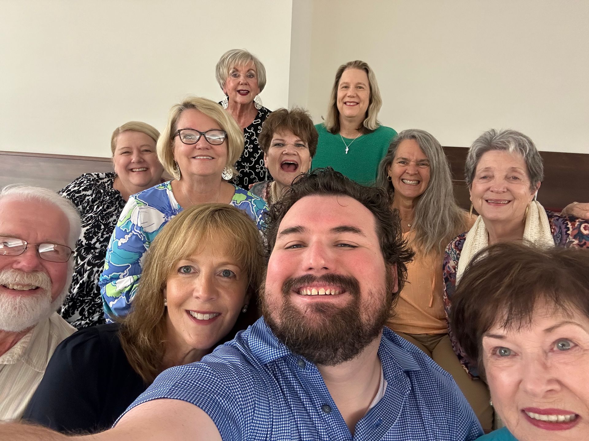 A group of handbell players pose for a picture