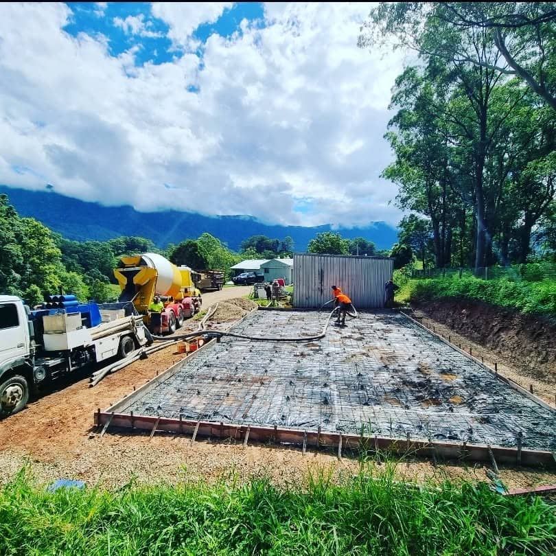 A Concrete Truck is Pouring Concrete — TJ Concreting in Federal, NSW