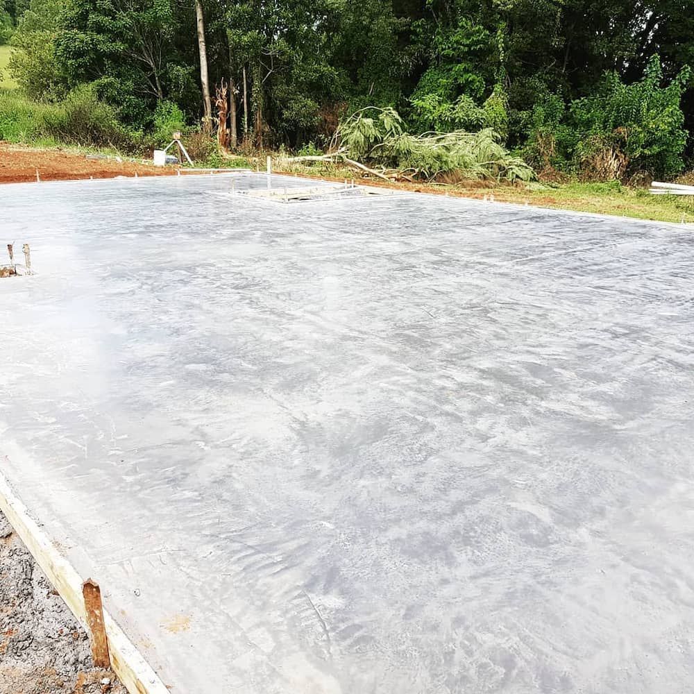 A Concrete Foundation is Being Built in a Field With Trees in the Background — TJ Concreting in Myocum, NSW