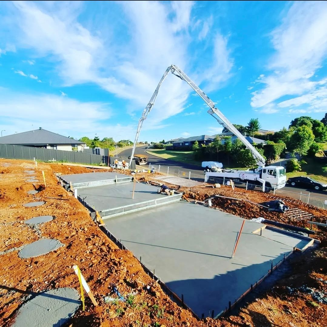 A Construction Site With a Fence and a Grid on the Ground — TJ Concreting in Mullumbimby, NSW