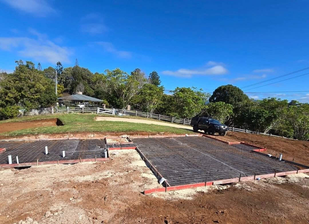 Two Construction Workers Are Working on a Concrete Slab — TJ Concreting in Federal, NSW