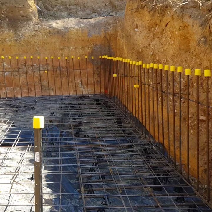 A Construction Site With a Yellow Pole in the Middle — TJ Concreting in Myocum, NSW
