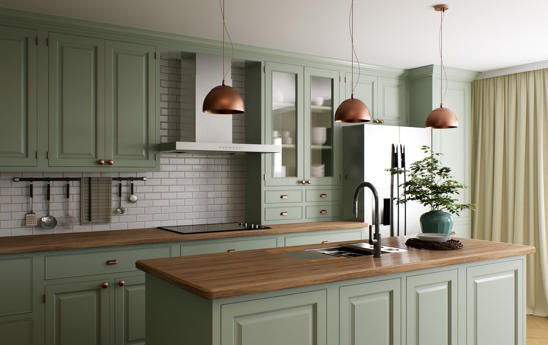 A kitchen with green cabinets and a large island in the middle.