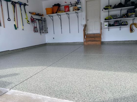 A garage with a lot of shelves and tools on the wall