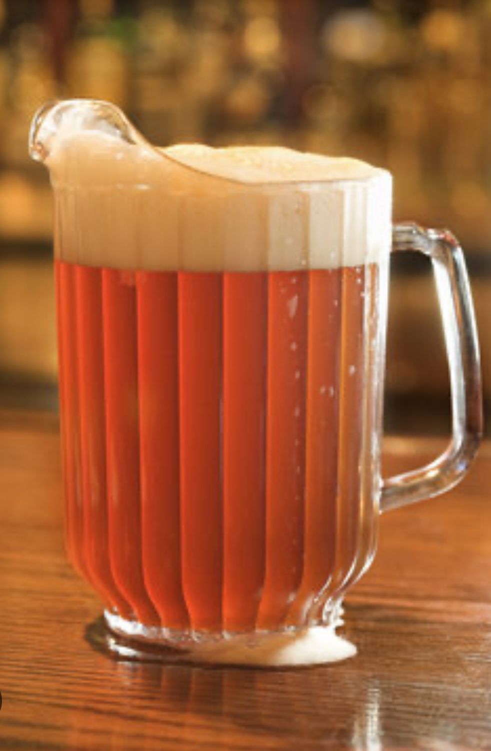 Two women enjoying pizza and food with wine.