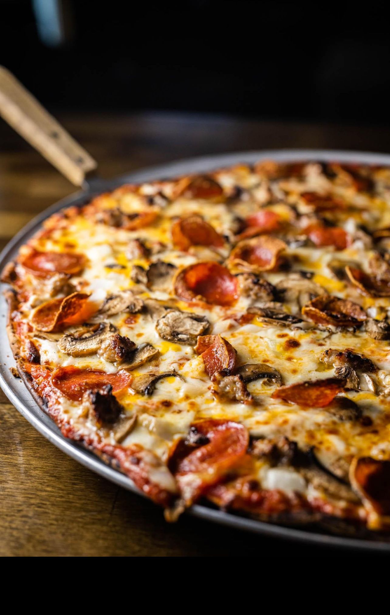 Various pizzas on trays