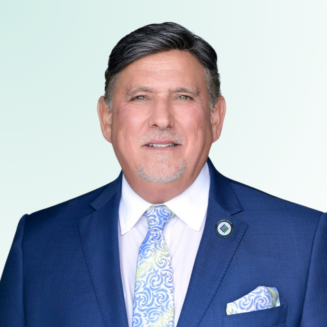 ChamberSouth  A man in a blue suit and tie is smiling for the camera