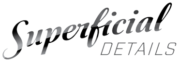 Stylized black and gray logo reading “Superficial Details” on a white background