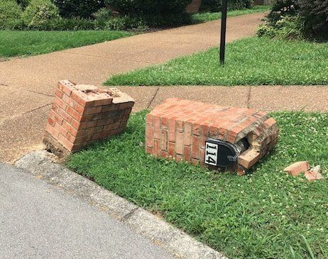 damaged brick mailbox
