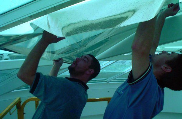 workers applying tint
