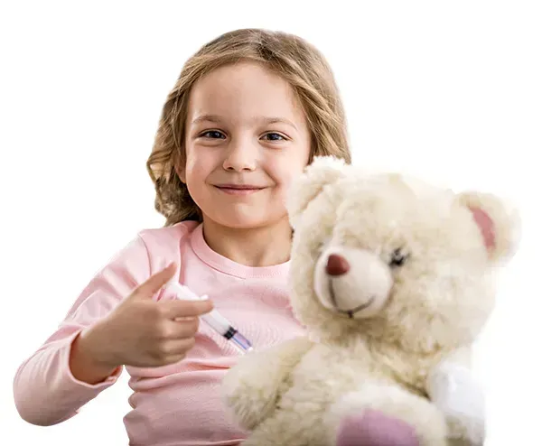A little girl is holding a teddy bear and giving a thumbs up