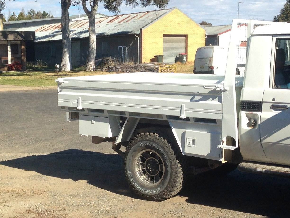 A White Truck With UTE Is Parked On The Side Of The Road — ASSB Armidale Sand & Soda Blasting In  Armidale, NSW