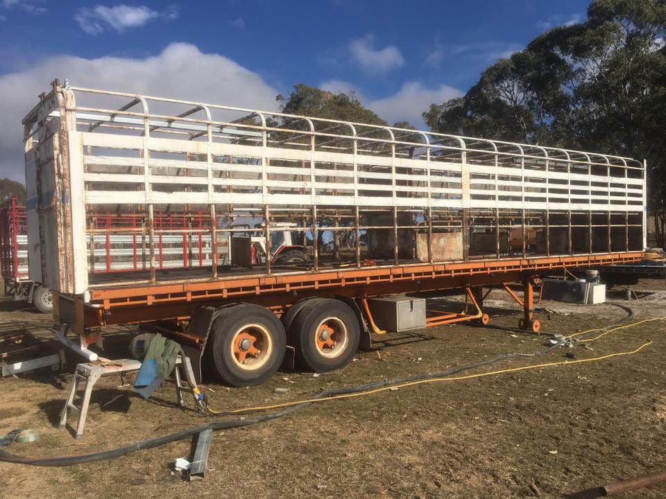 A Large Trailer Is Sitting in The Middle of A Field — ASSB Armidale Sand & Soda Blasting In  Armidale, NSW