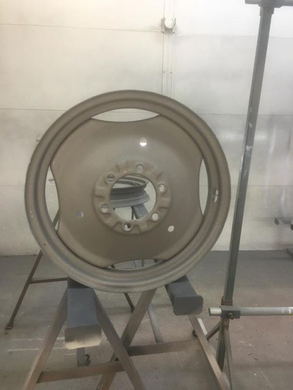 A Close-Up of A Wheel on A Stand with Powder Coating Paint — ASSB Armidale Sand & Soda Blasting In Guyra, NSW