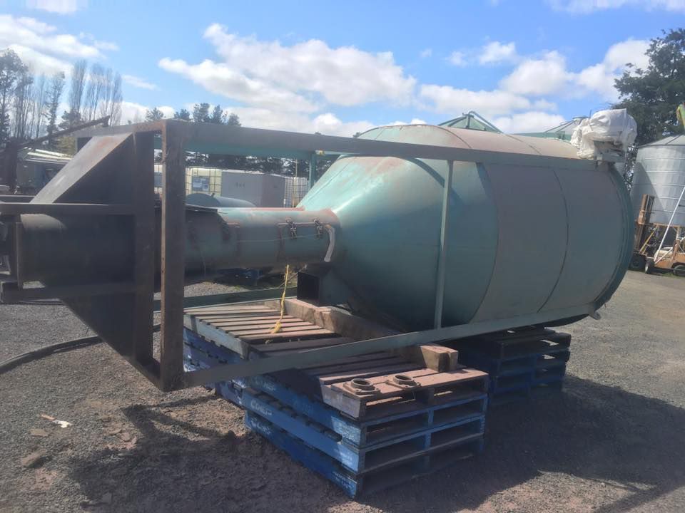 A Large Green Tank Is Sitting on Top of Pallets — ASSB Armidale Sand & Soda Blasting In Armidale, NSW