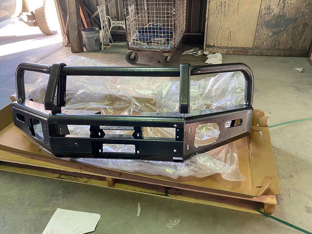 A Front Metal Truck Bumper With Black Colour Paint — ASSB Armidale Sand & Soda Blasting In Glen Innes, NSW