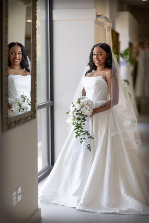 A woman in a wedding dress is getting ready for her wedding.