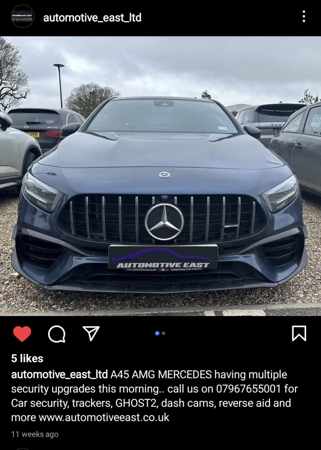 A blue mercedes amg is parked in a parking lot.