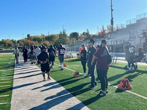 Dr. Eric Owashi on football sidelines