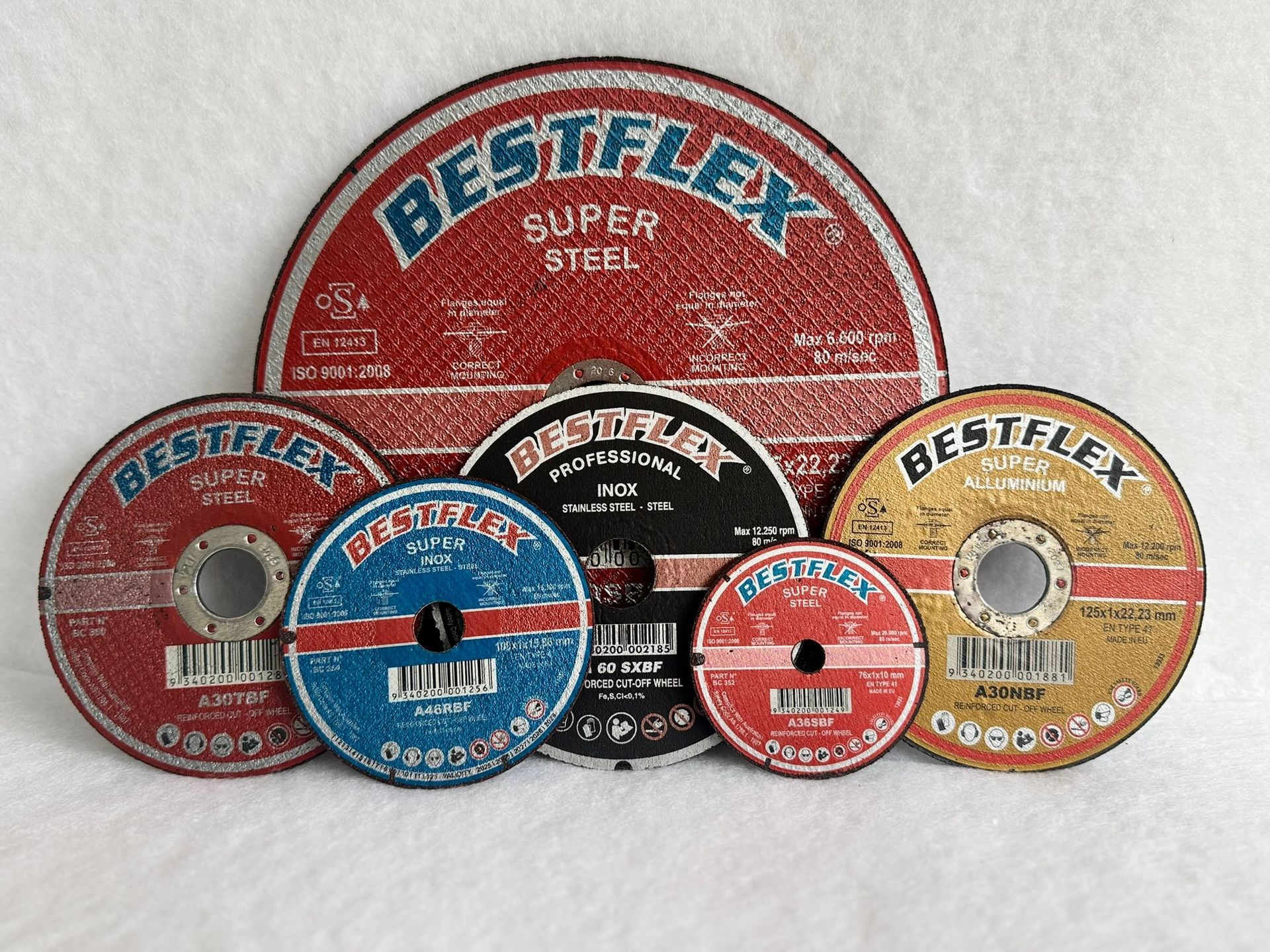 A bunch of discs are sitting on top of each other on a table.