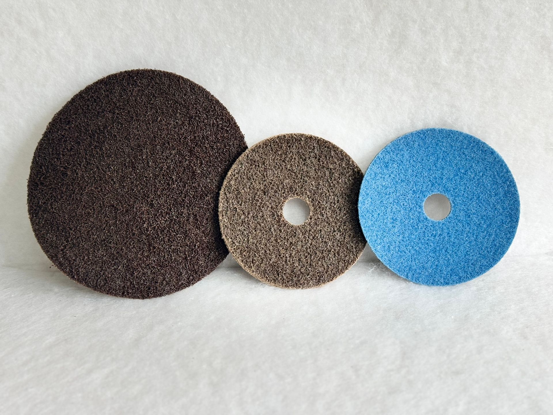 Three different colored circles are lined up on a white surface