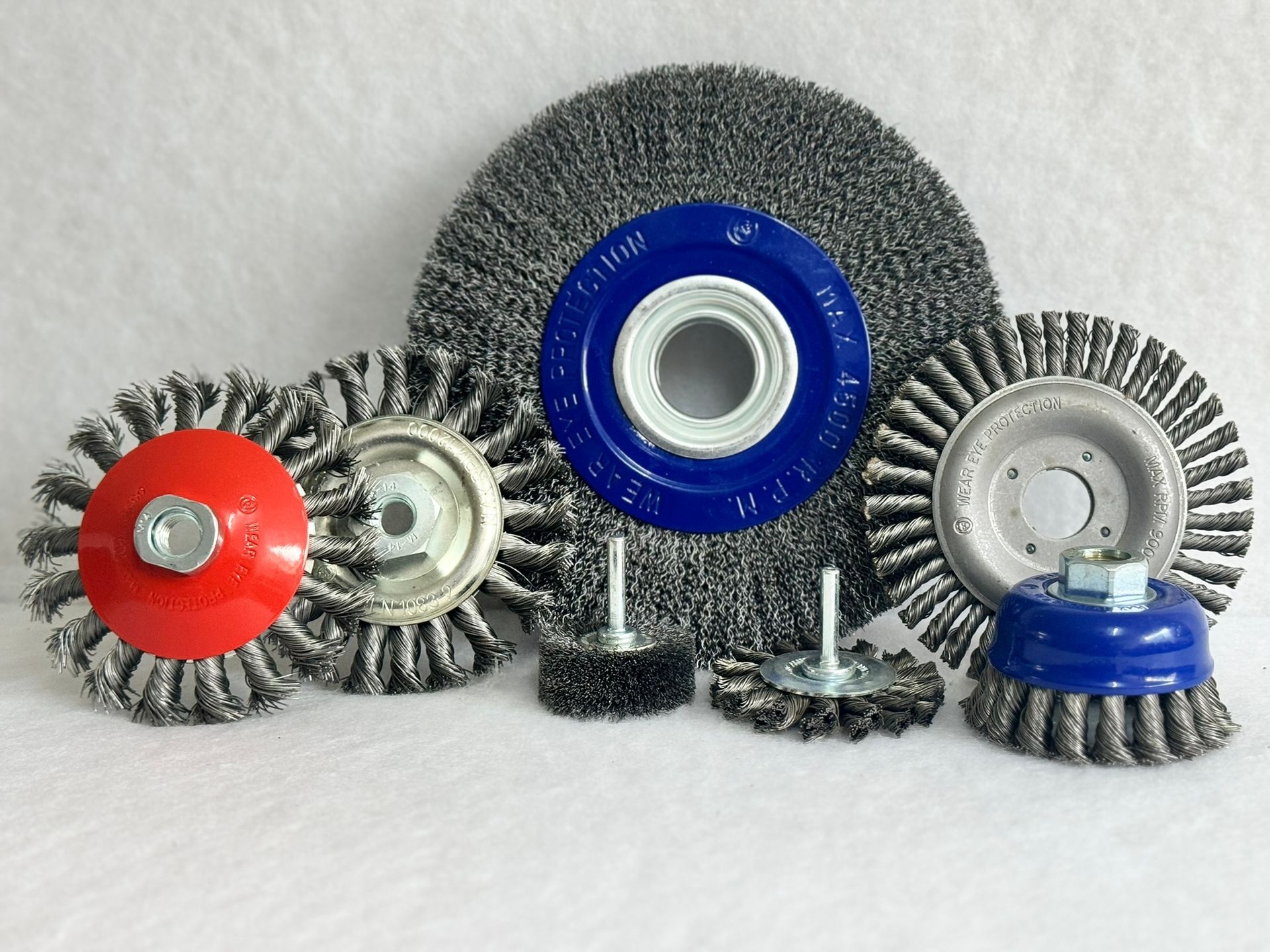 A group of gears are sitting on top of each other on a white surface.