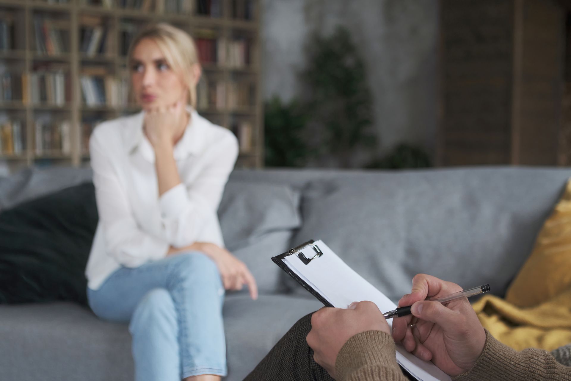 Professional male doctor listening woman with mental issues
