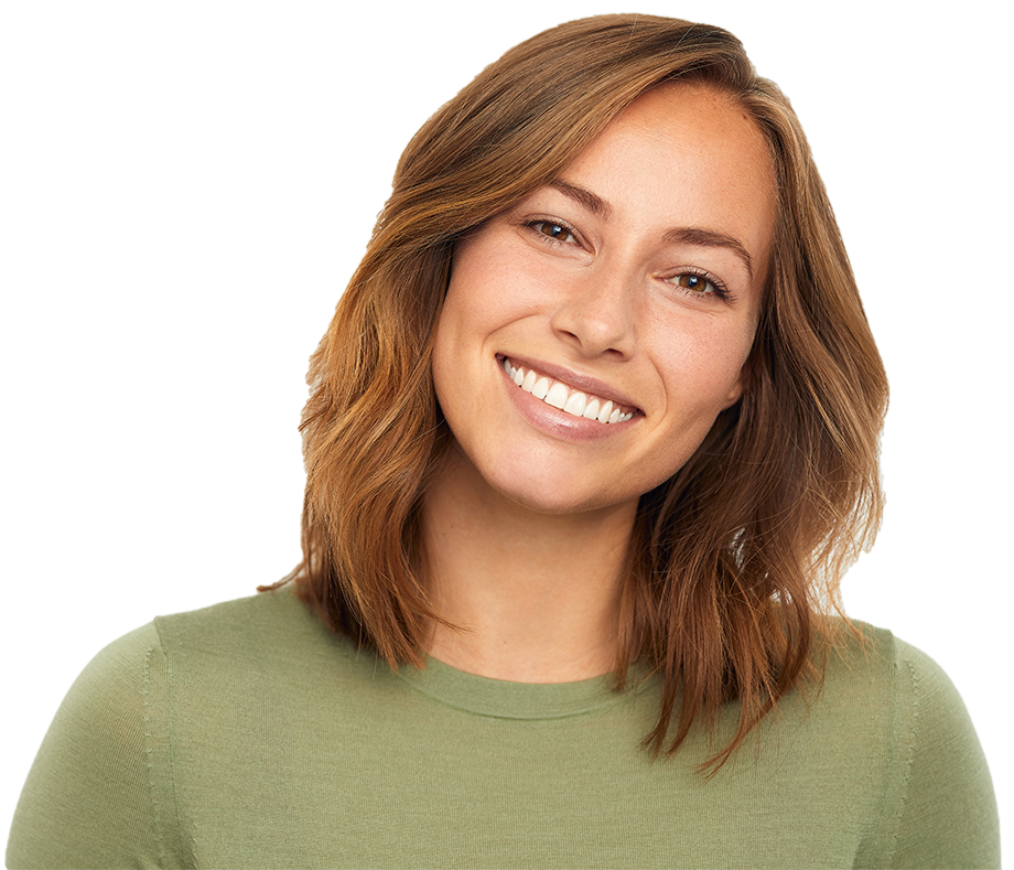 A woman in a green sweater is smiling for the camera.