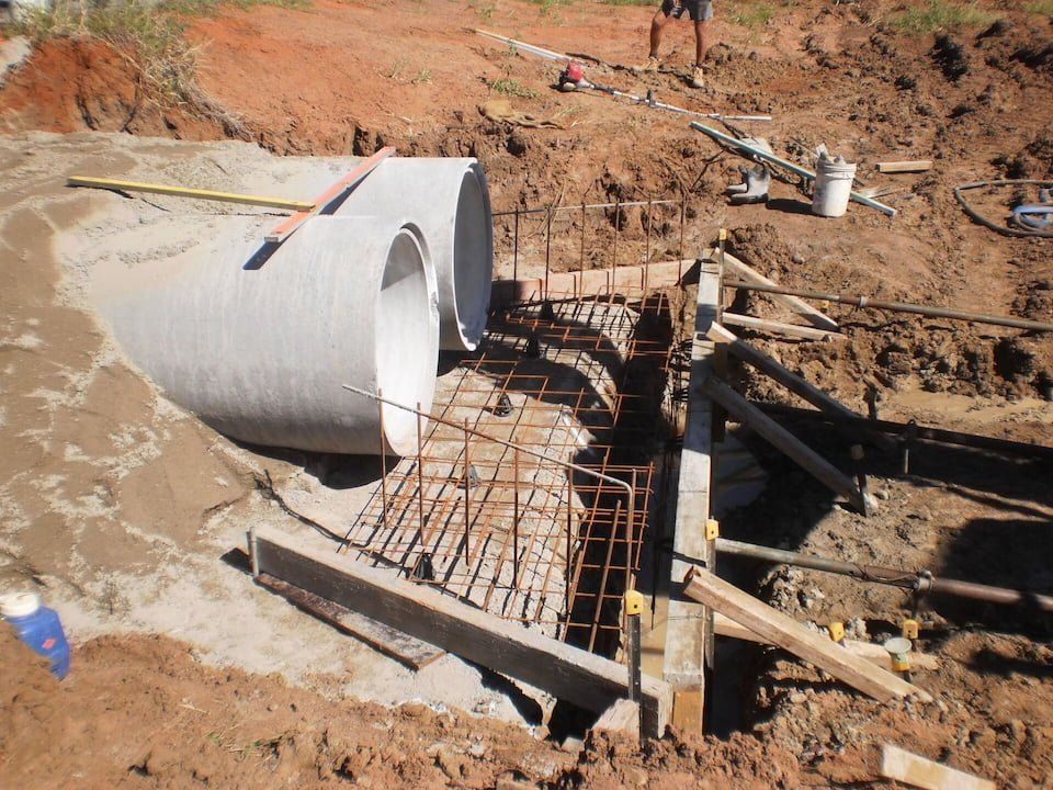 Drainage Outlet With Two Large Pipes  — Whitsunday Drainage Contractors in Cannonvale, QLD