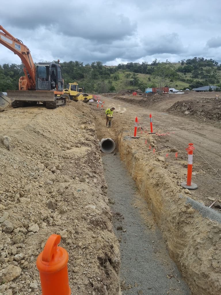 Pipeline Being Installed in Rural Area  — Whitsunday Drainage Contractors in Cannonvale, QLD