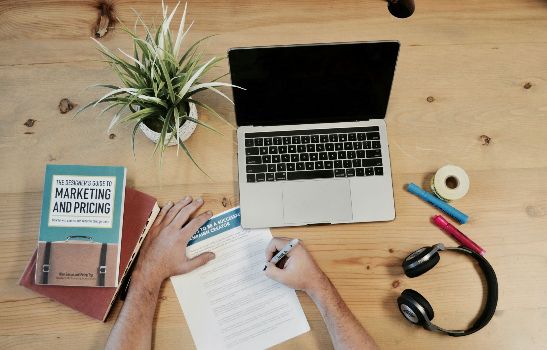 Data analyst reviewing cross-channel marketing attribution reports and ROI metrics