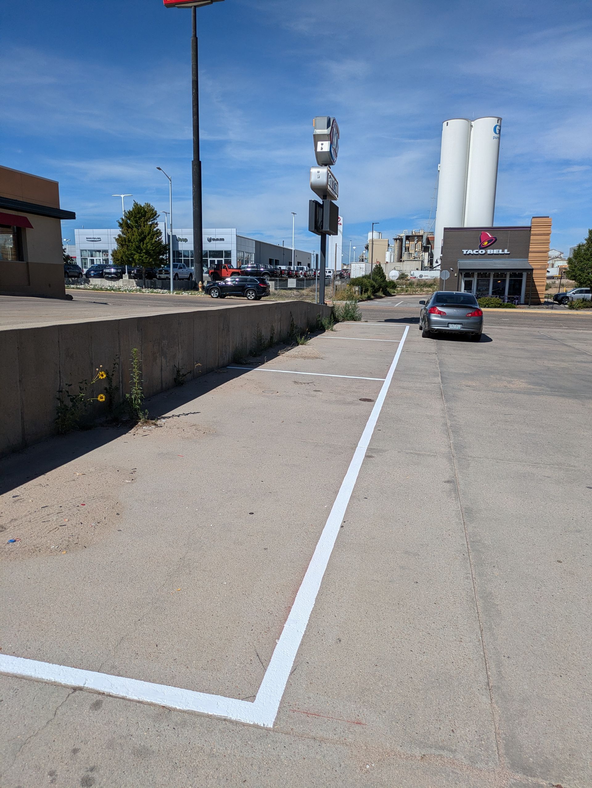 A parking lot with a white line in the middle