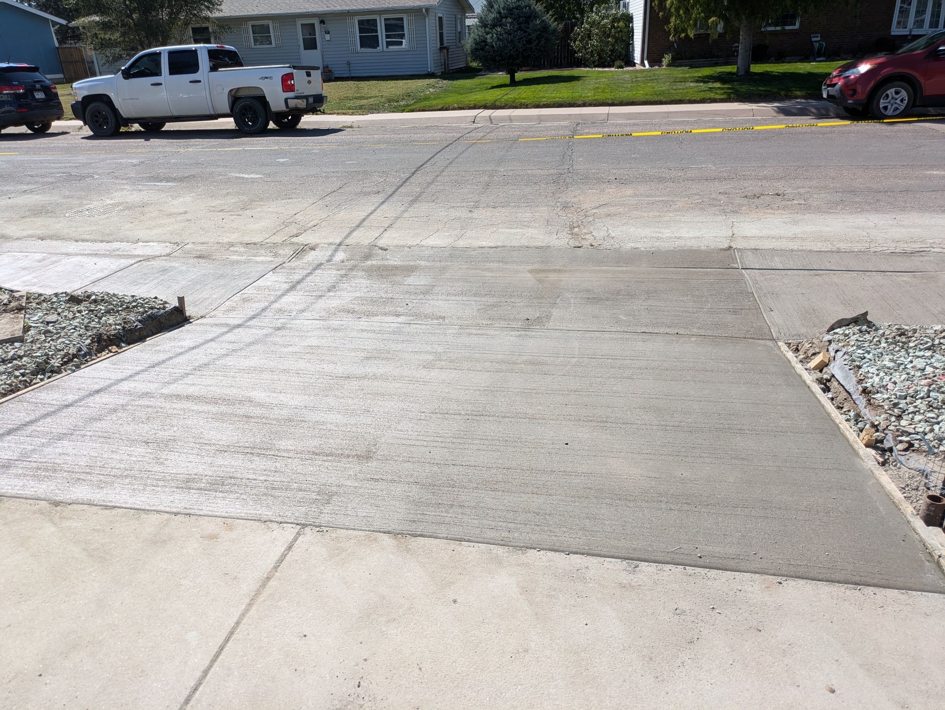 A white truck is parked on the side of the road