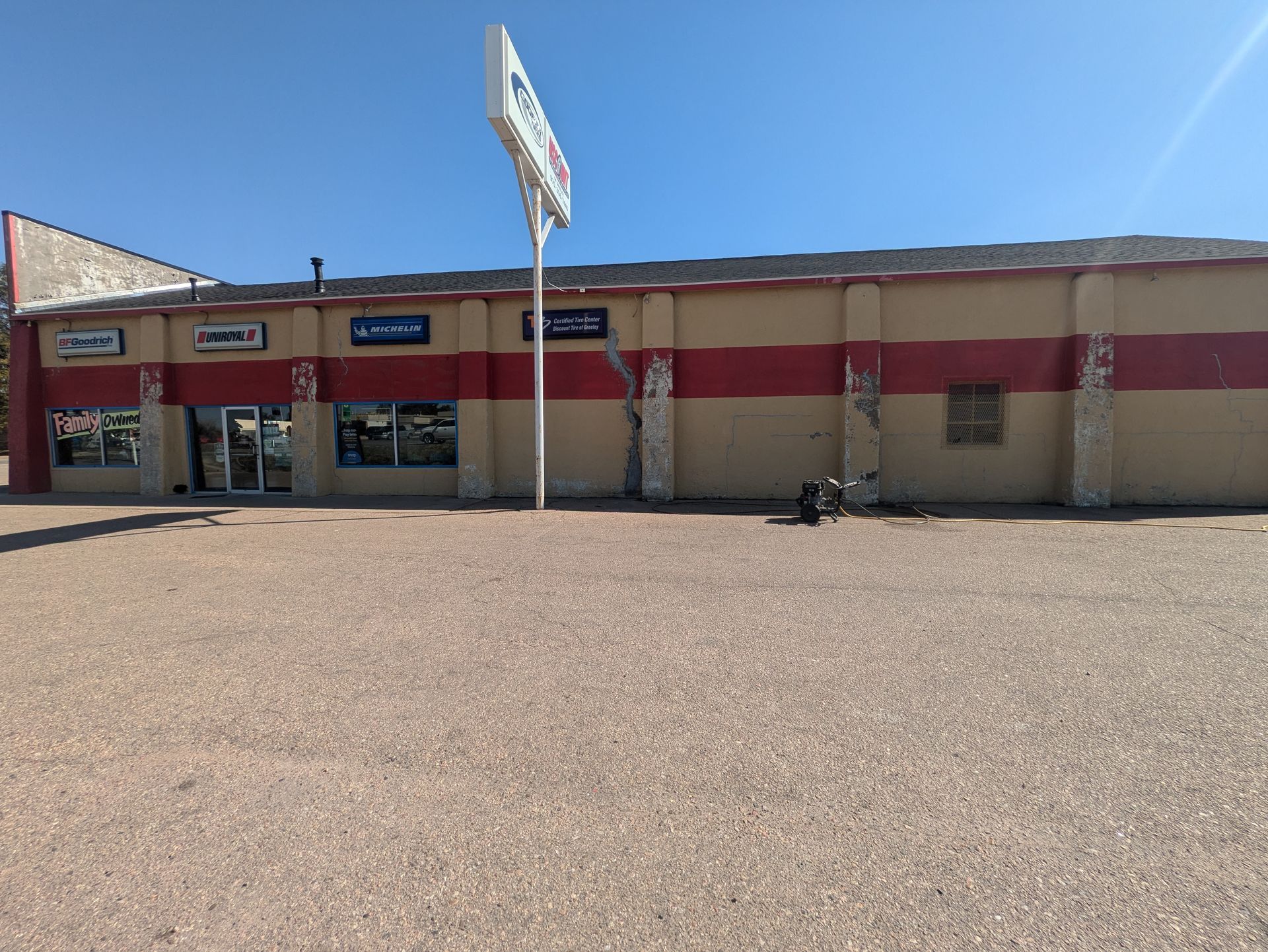 A large building with a sign in front of it