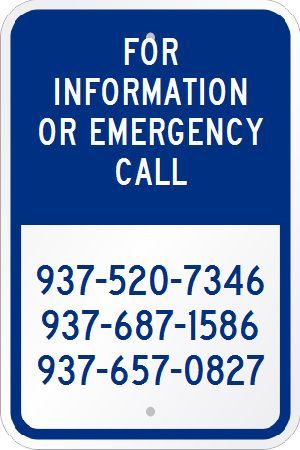 A blue and white sign that says `` for information or emergency call ''.